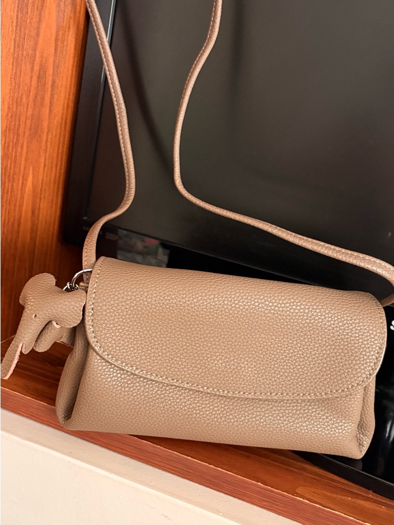 Pebbled Taupe Crossbody Bag With Decorative Charm